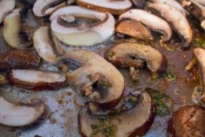 Mushrooms browning in pan