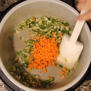 Cajun Jambalaya in the Ninja Foodi sauteing veggies