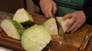 cutting cabbage into quarters