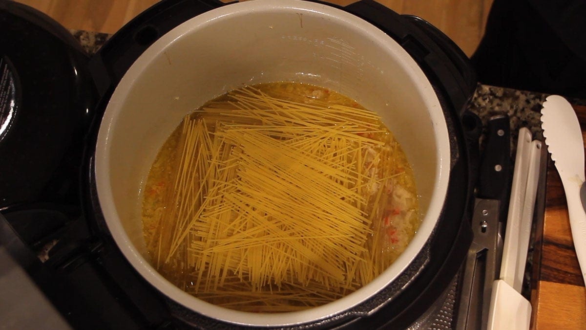 angel hair pasta crisscrossed in pot