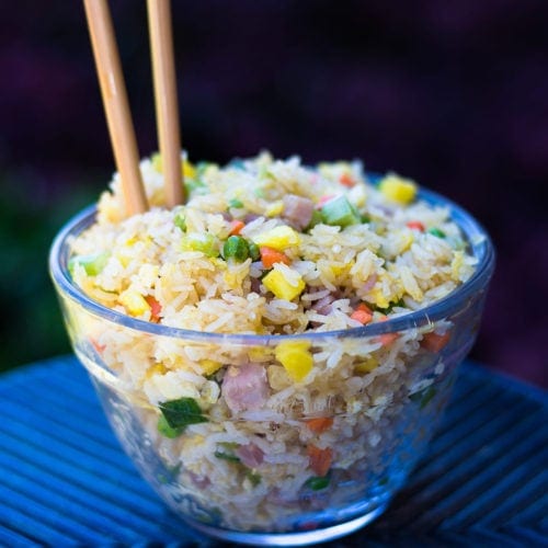 Hawaiian Fried Rice in a glass bowl with chopsticks