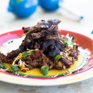 Mexican Pot Roast with rice and beans on a colorful plate