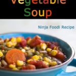 Pressure cooker vegetable soup in a blue bowl