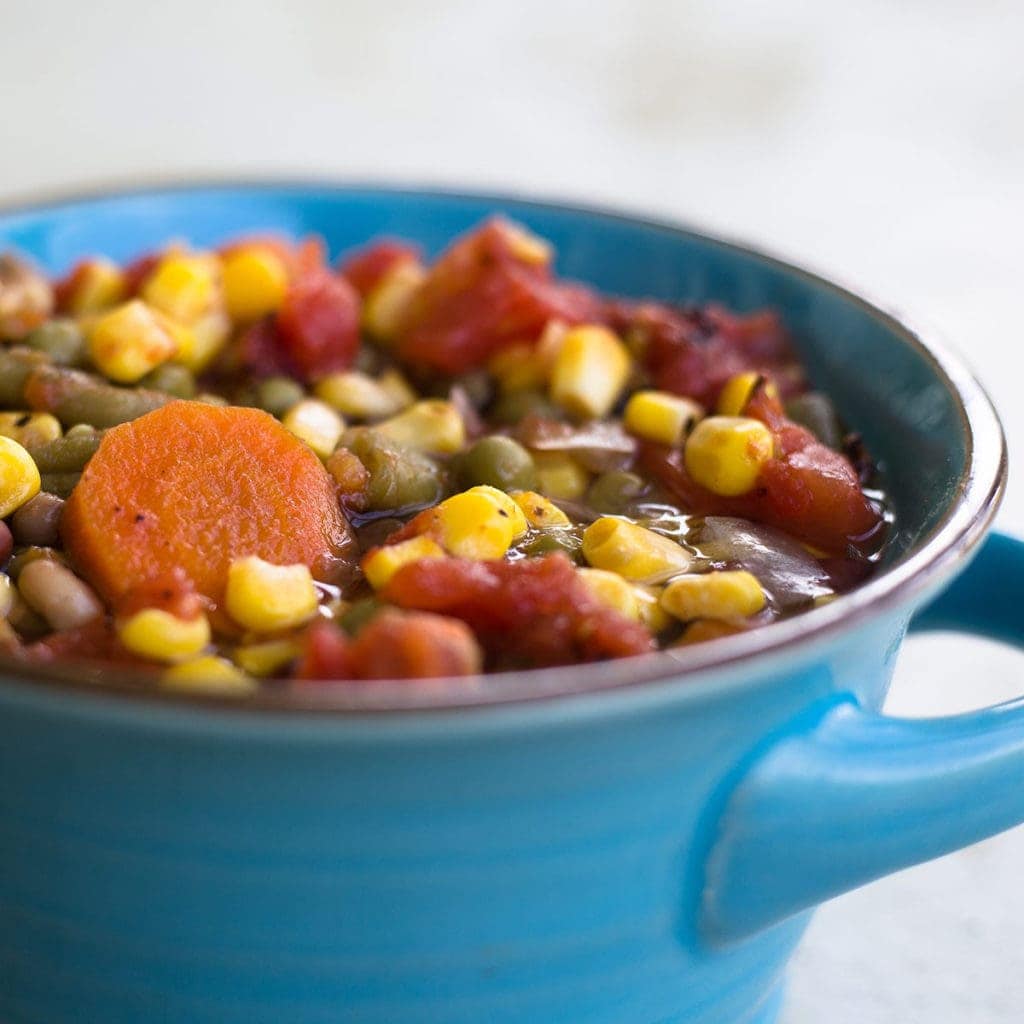 Pressure Cooker Vegetable Soup in a blue bowl