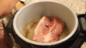 Pork Should in liquid in the inner pot of the Ninja Fooid