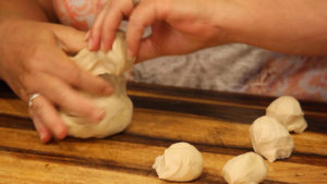 Forming dough into balls for Asian Steamed Buns 