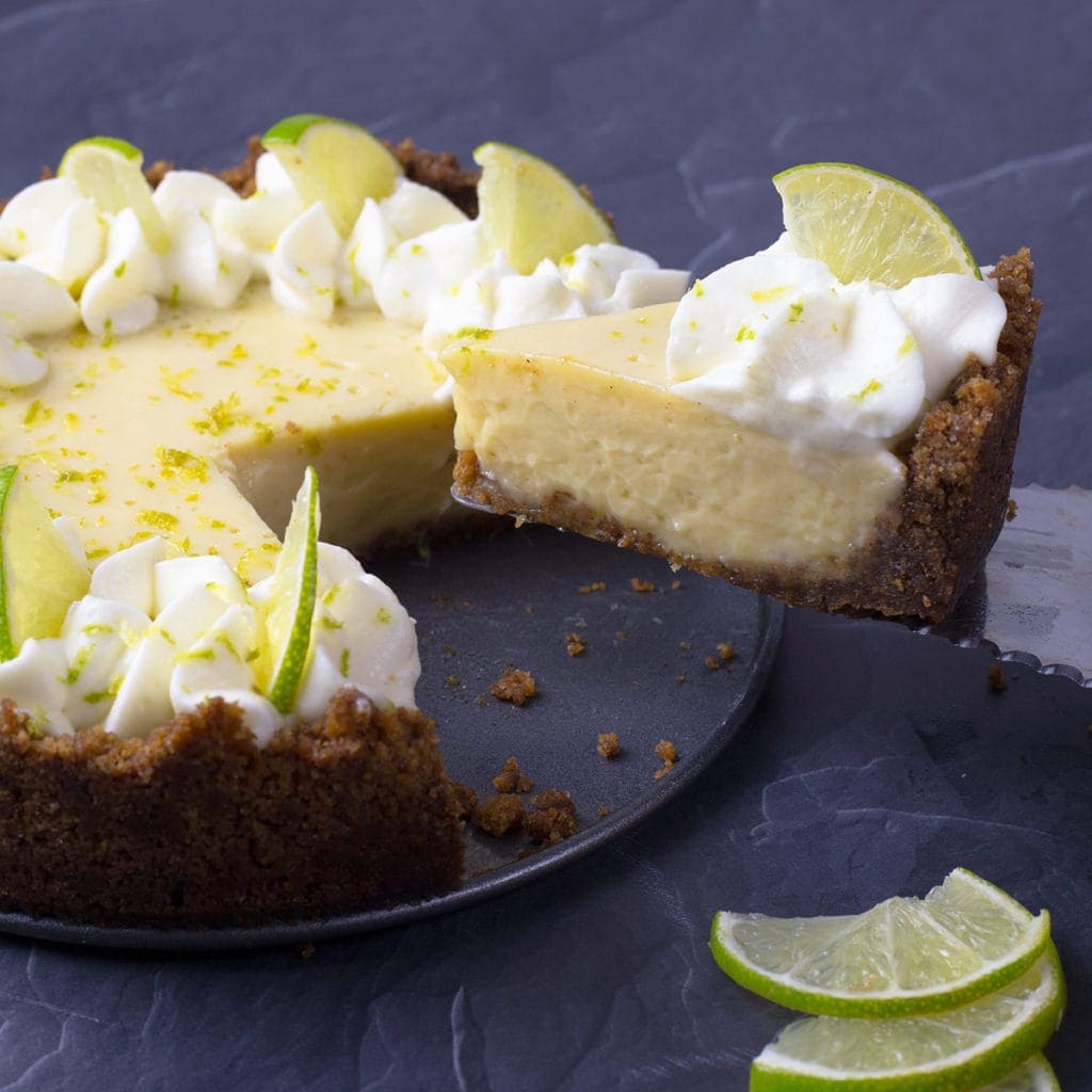 Key Lime Pie with a piece being taken out