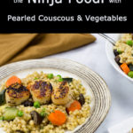 Seared Scallops on a plate of pearled couscous and vegetables