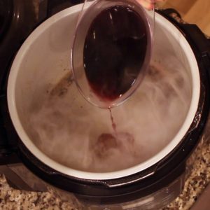 deglazing the pot with wine