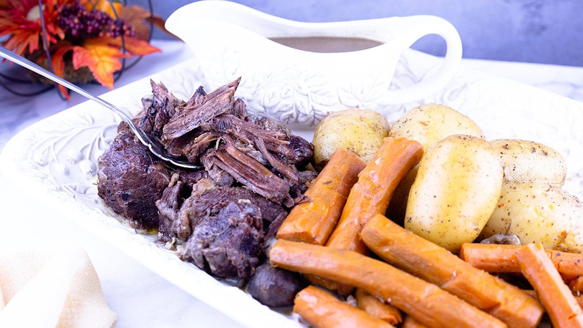 Quick and easy pot roast on a white platter