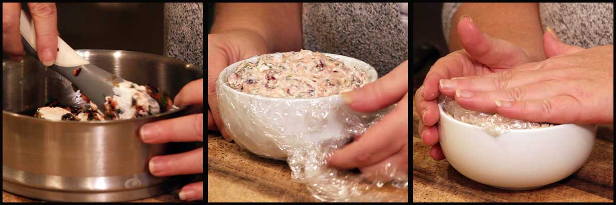Folding cream cheese and cranberry mixture together and putting in a bowl lined with seran wrap