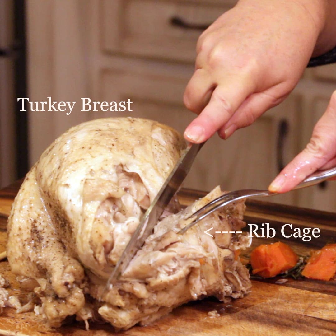 removing the rib cage of the turkey breast