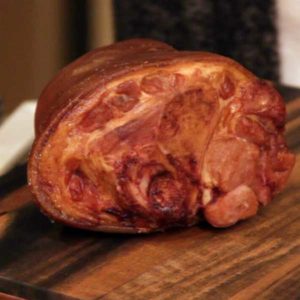 Picture of a ham hock sitting on the cutting board