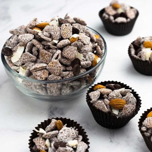 Almond Joy cereal snack mix in a bowl and in cupcake liners