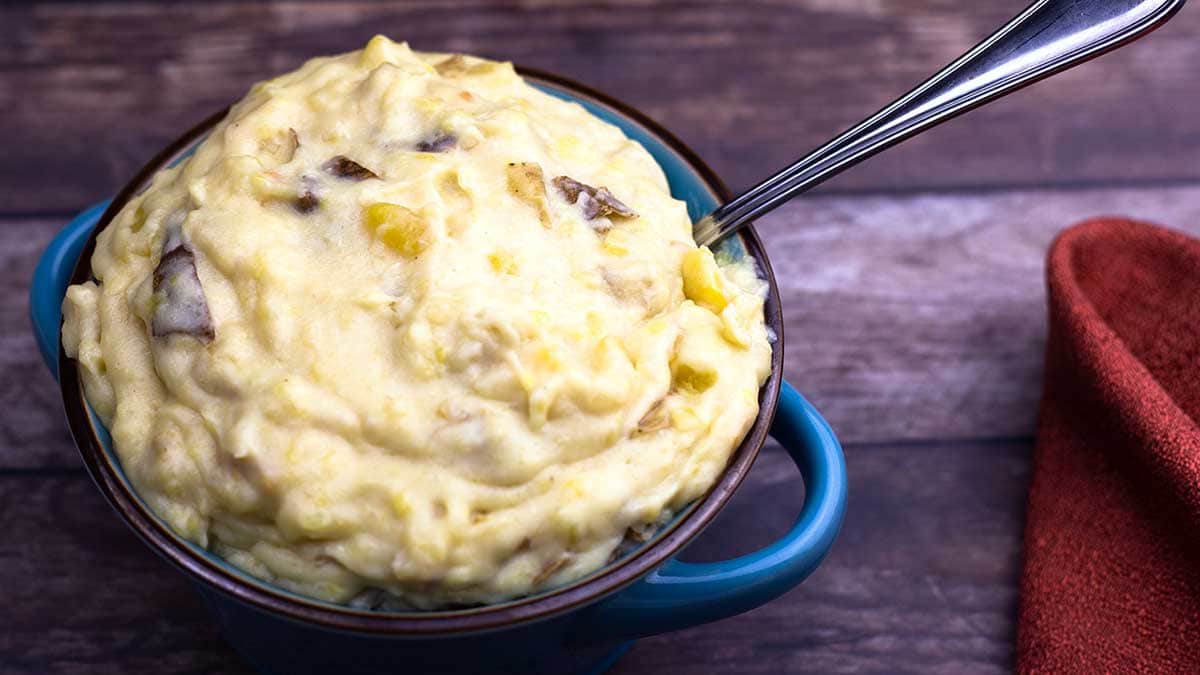 Cheesy Garlic Potatoes in a blue bowl
