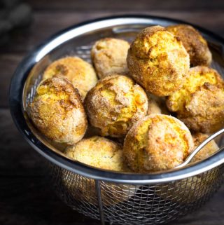hushpuppies sitting in a metal basket with holes