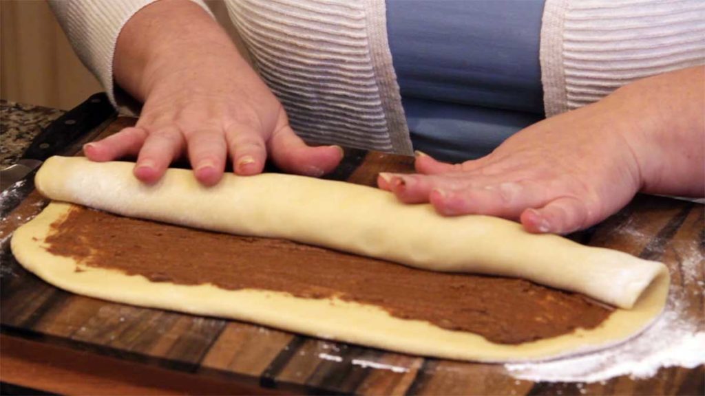 Rolling the dough into a log
