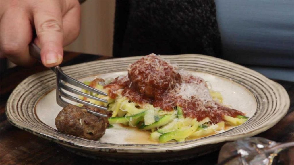 serving air fryer meatballs with zoodles and marinara sauce