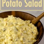 Amish Potato Salad in a wooden bowl with a spoon