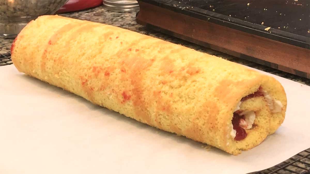 Strawberry Roll Cake on parchment