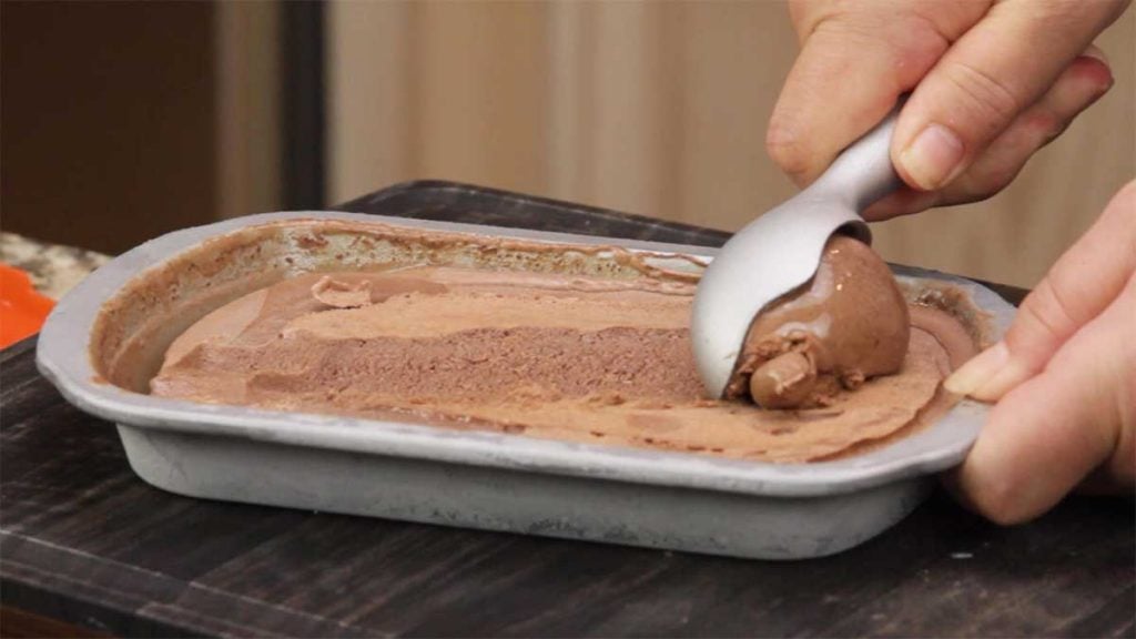 scooping out the chocolate ice cream