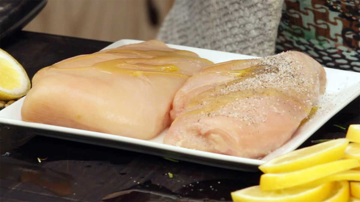 seasoning chicken with olive oil, salt and pepper