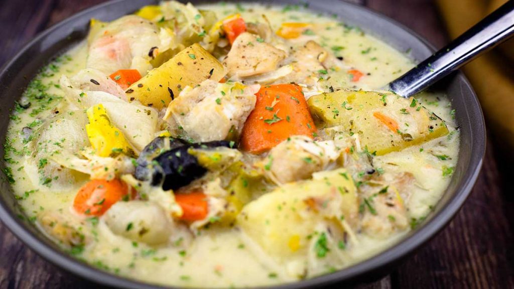 Chicken Stew in a bowl with a spoon