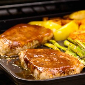 sheet pan pork chops with apples, potatoes, asparagus