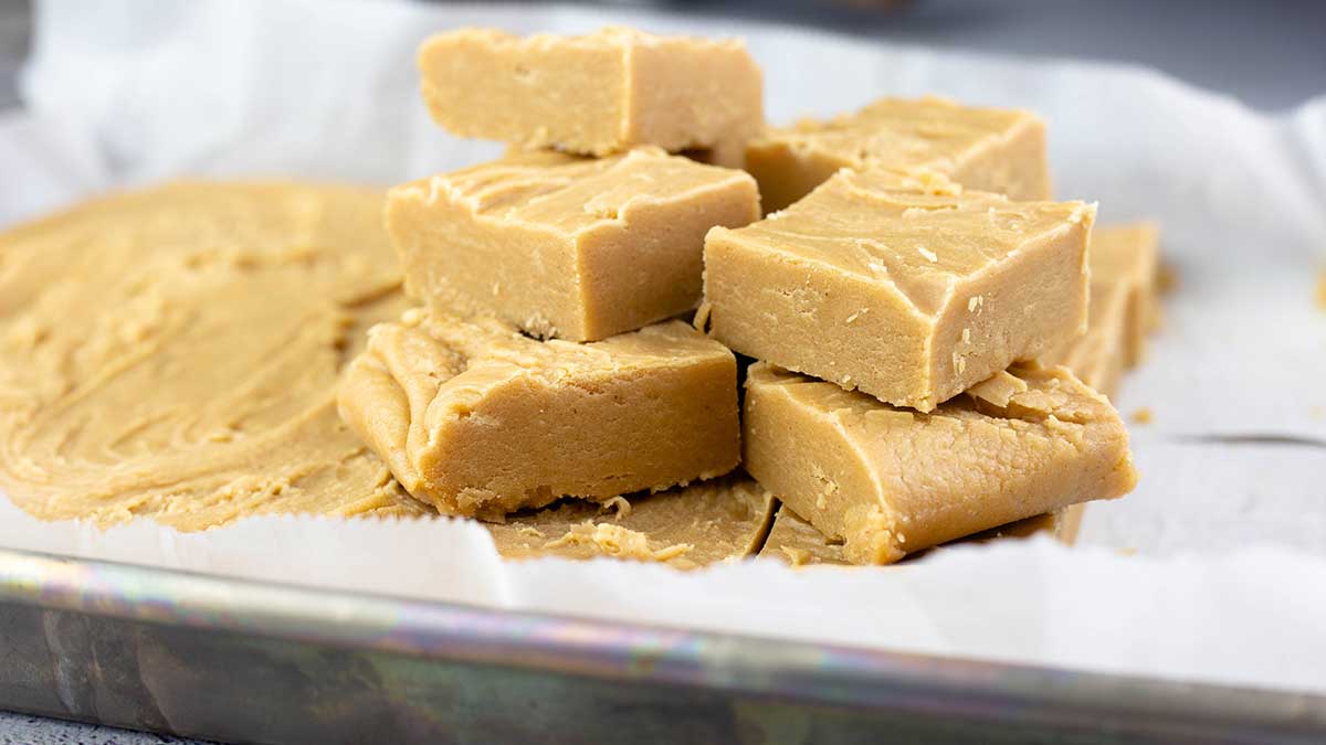 Old Fashioned Peanut Butter Fudge stacked on a tray