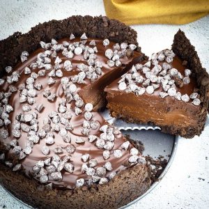 triple chocolate cheesecake with a slice being removed