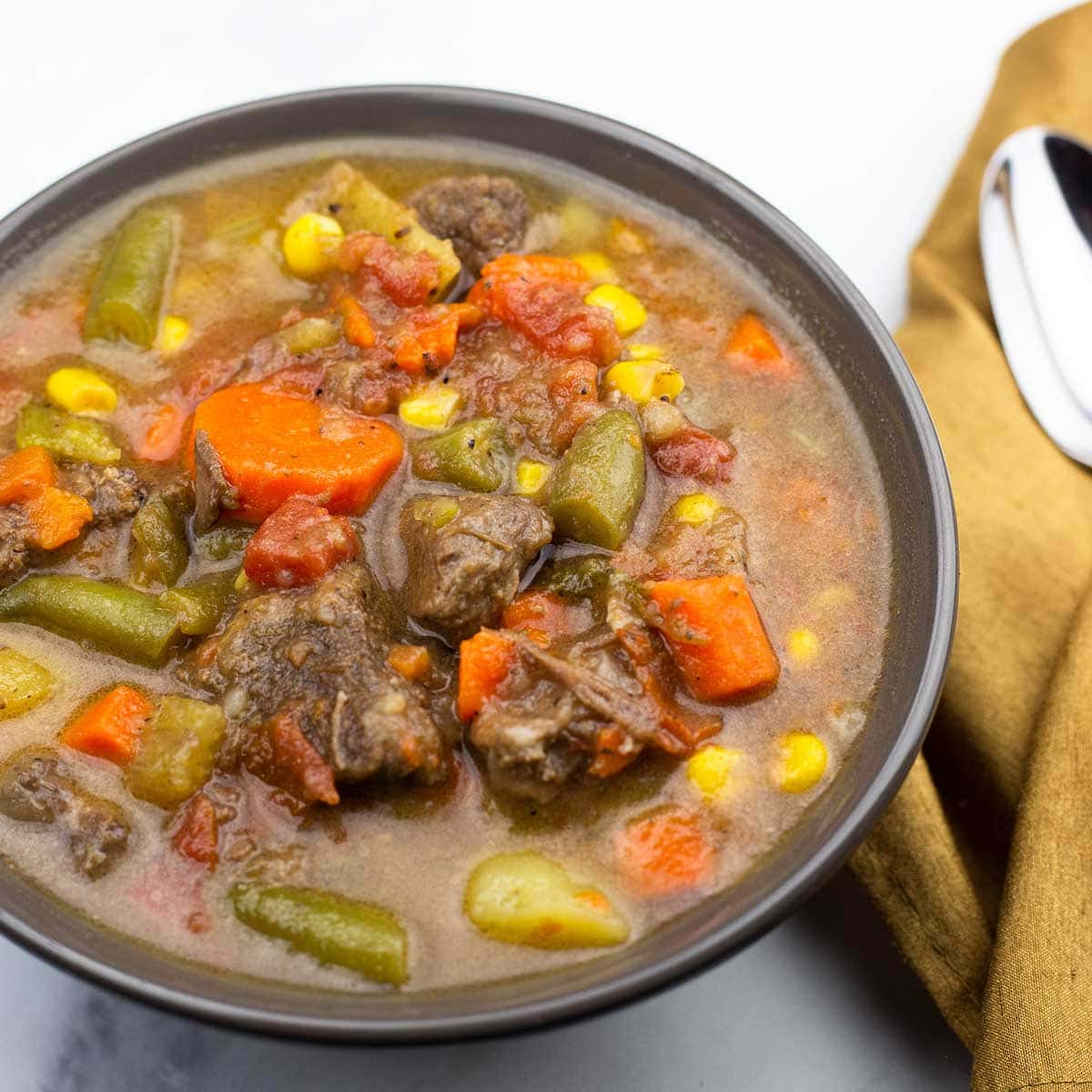 Vegetable Beef Soup in a brown bowl