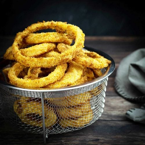 air fryer onion rings in a basket