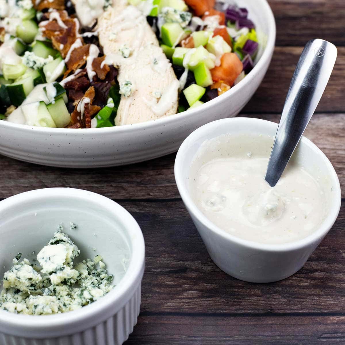 Blue Cheese Vinaigrette in a bowl next to a salad