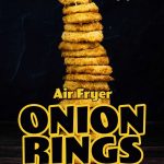 onion rings stacked high on a metal tower