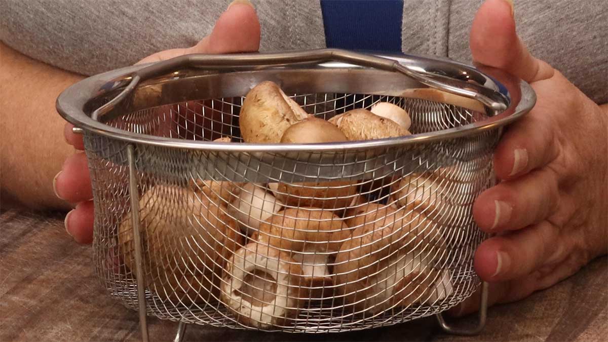baby portobello mushrooms in a basket