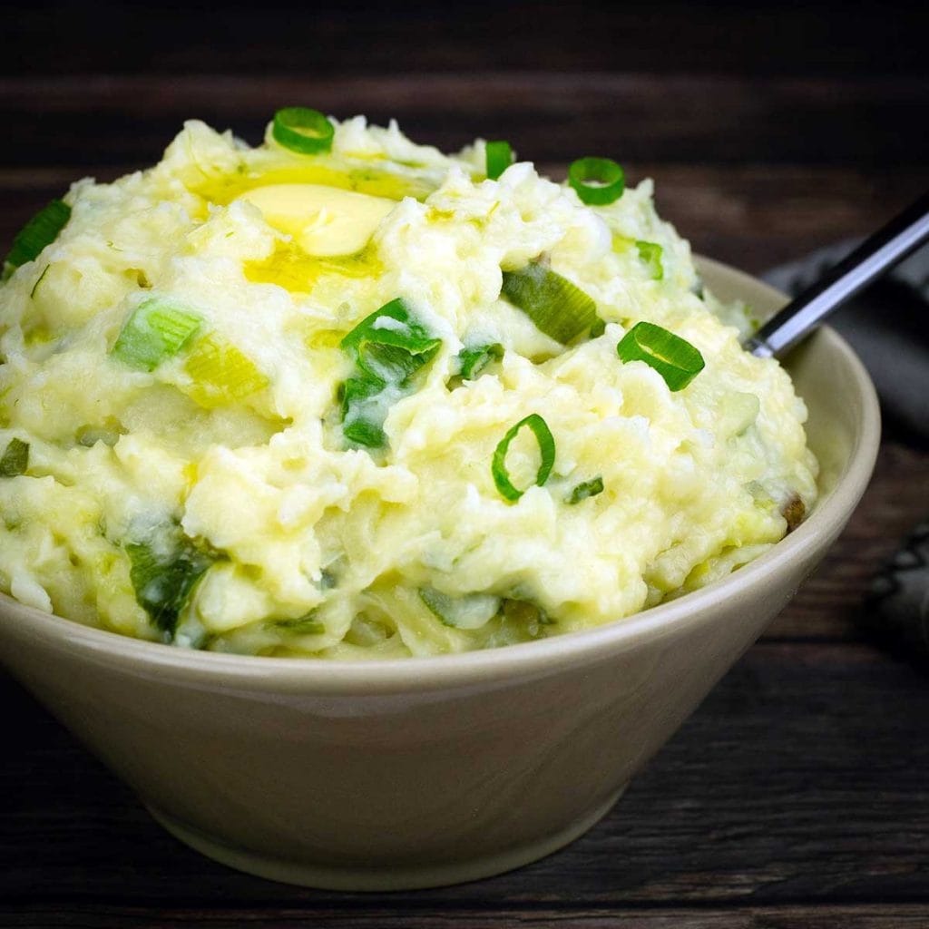 colcannon in a bowl with butter on top