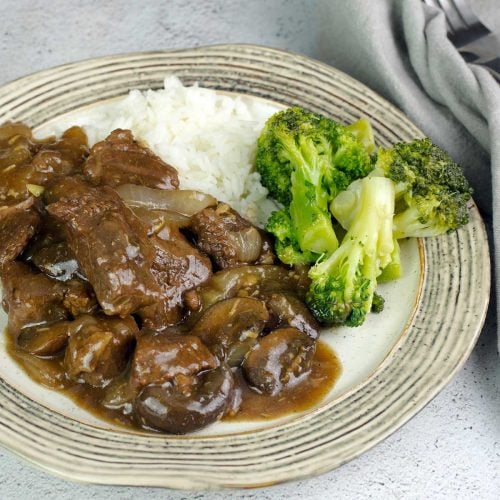 beef tips & rice with broccoli on a plate