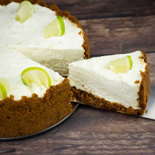 no bake key lime cheesecake with one slice being removed