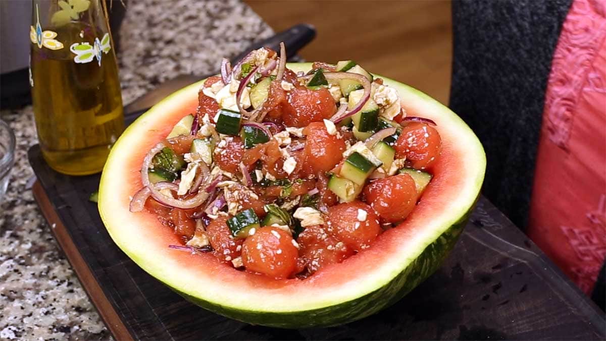 watermelon salad in watermelon rind to serve