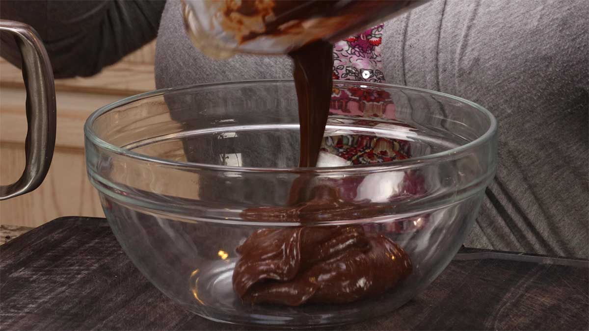 pouring chocolate mixture from blender into a bowl to cool