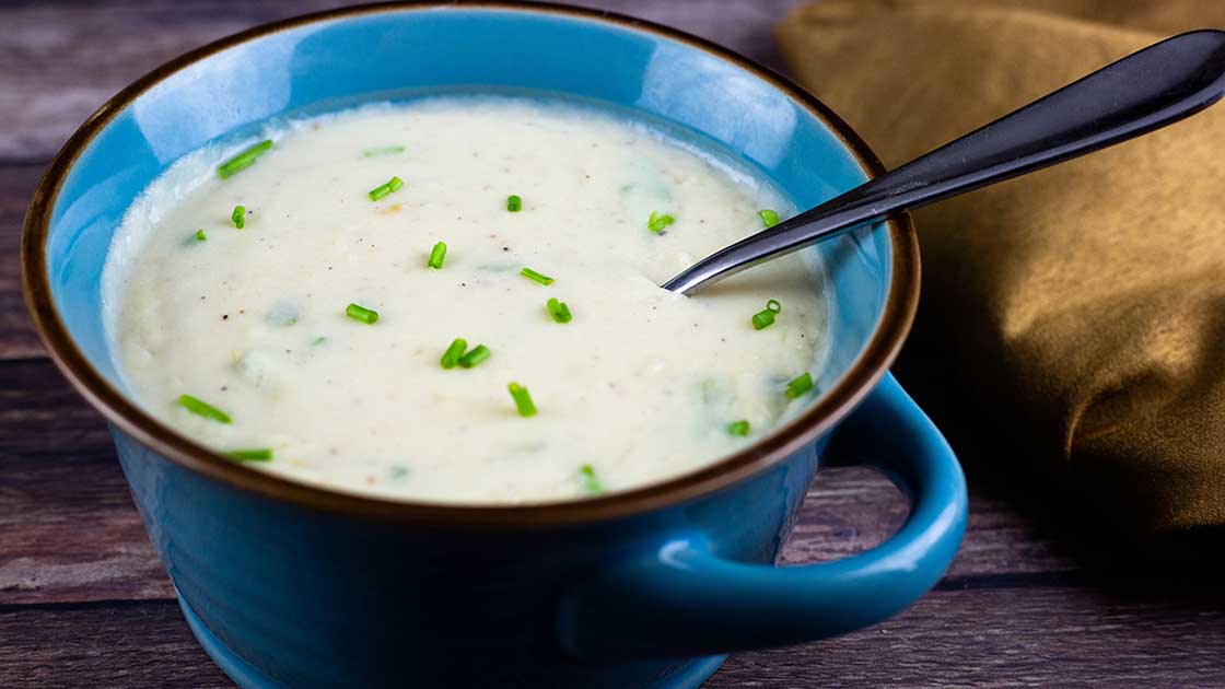 potato soup in a blue bowl