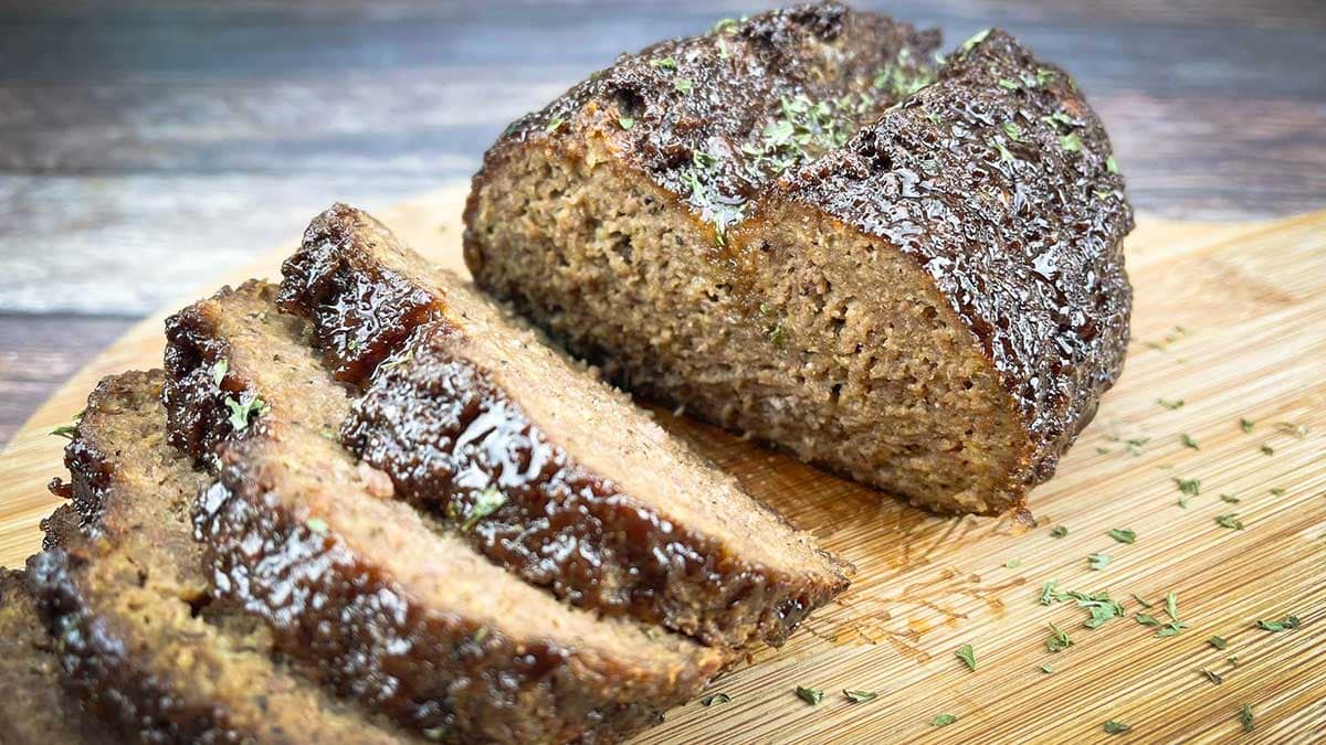 Air fryer meatloaf sliced on a cutting board