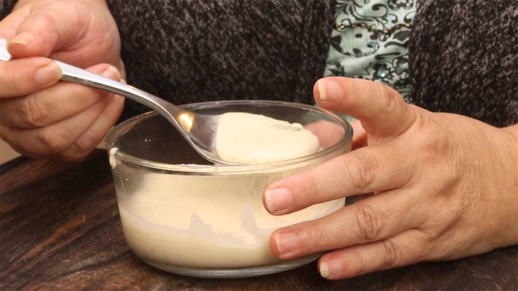 bowl of potato soup with spoon