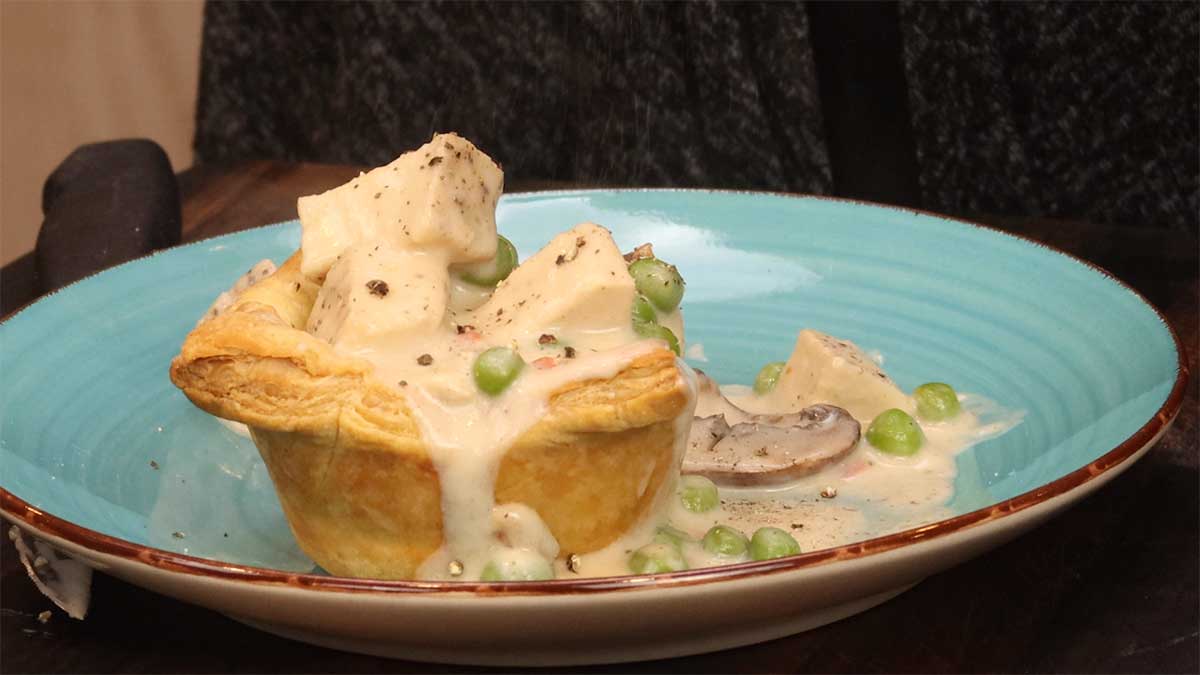 serving chicken a la king in a puff pastry shell