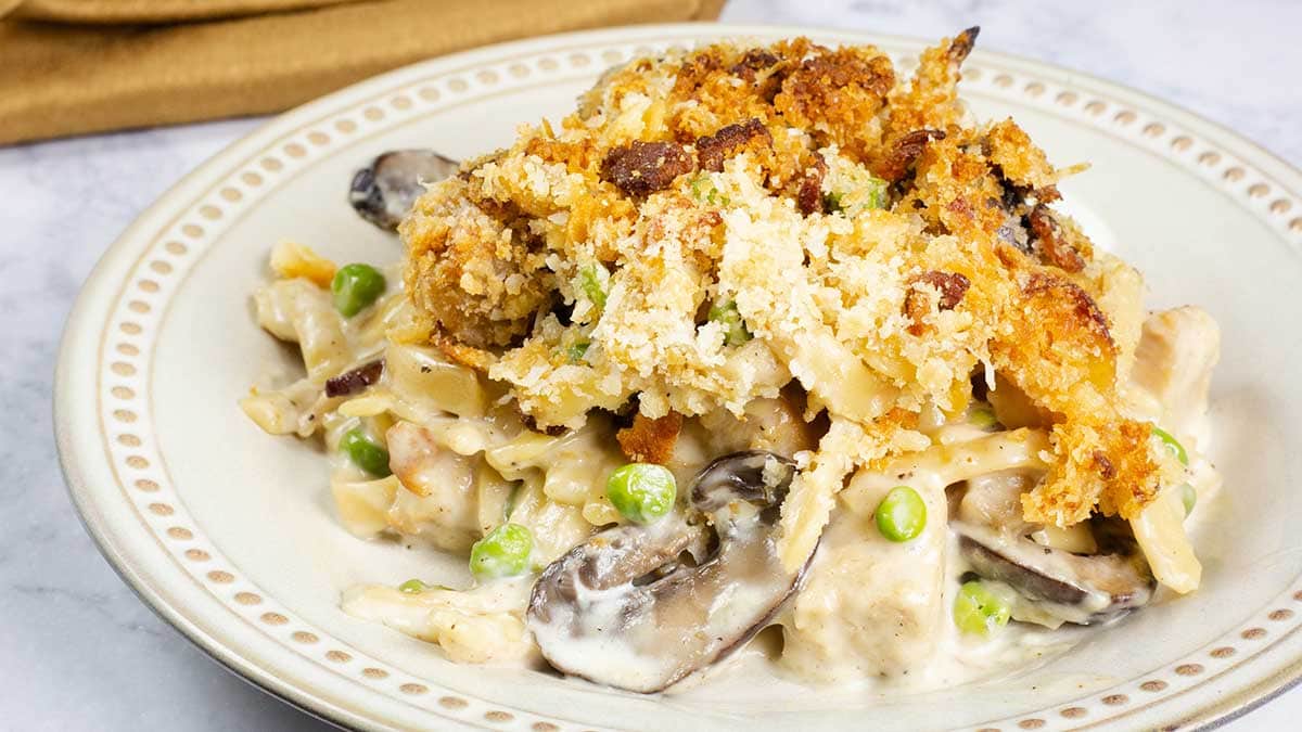 serving of turkey tetrazzini on a plate with crispy topping