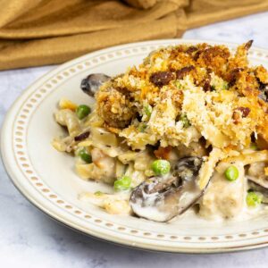 serving of turkey tetrazzini on a plate with crispy topping