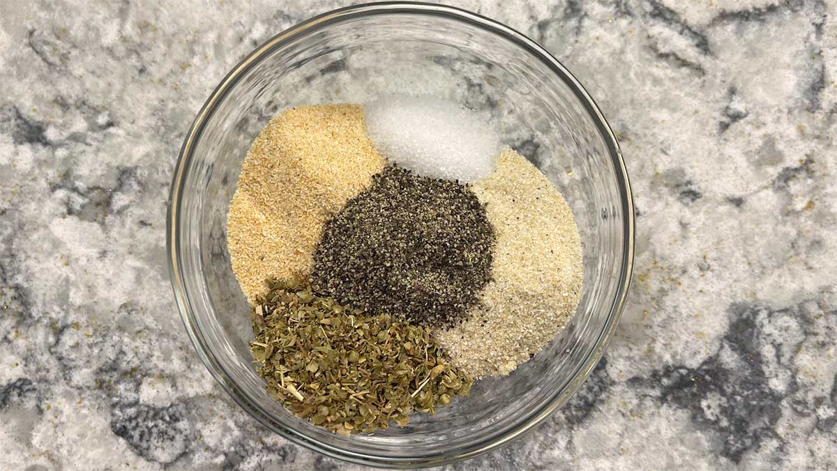 basic seasonings for red beans and rice in a small glass bowl.
