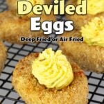 fried deviled eggs on a cooling rack.