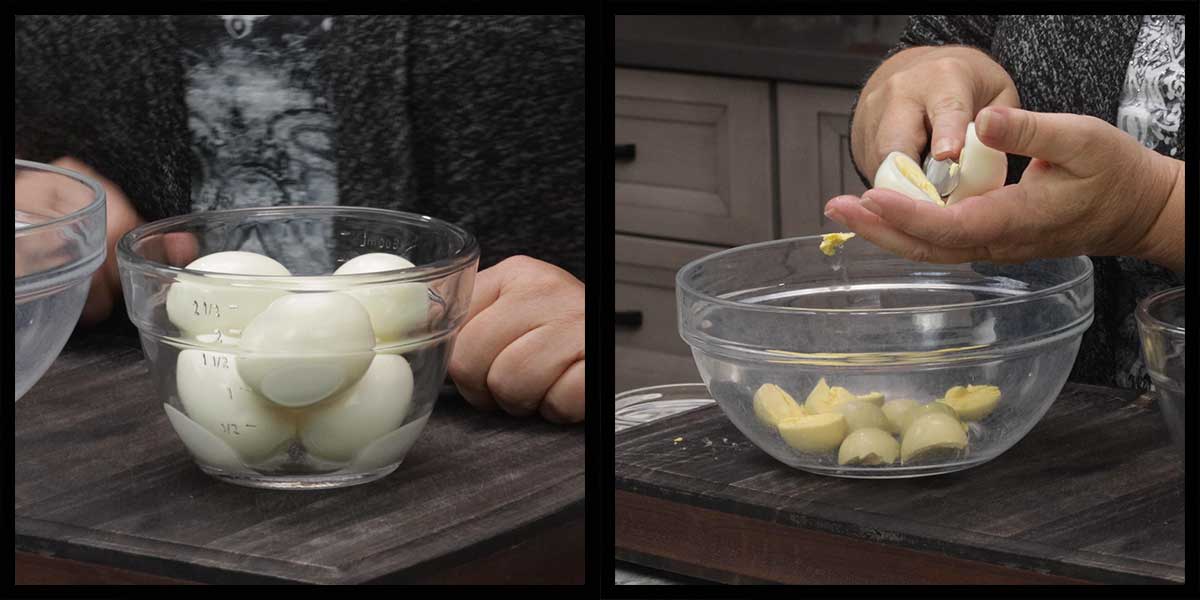 cutting the hard boiled eggs in half and putting yolks into a medium size bowl.