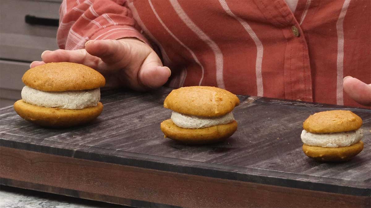 3 different sizes of pumpkin whoopie pies.